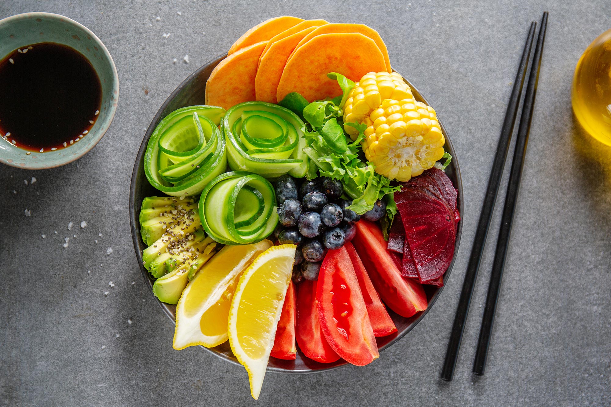 vegan buddha bowl with vegetables fruits served bowl grey background closeup