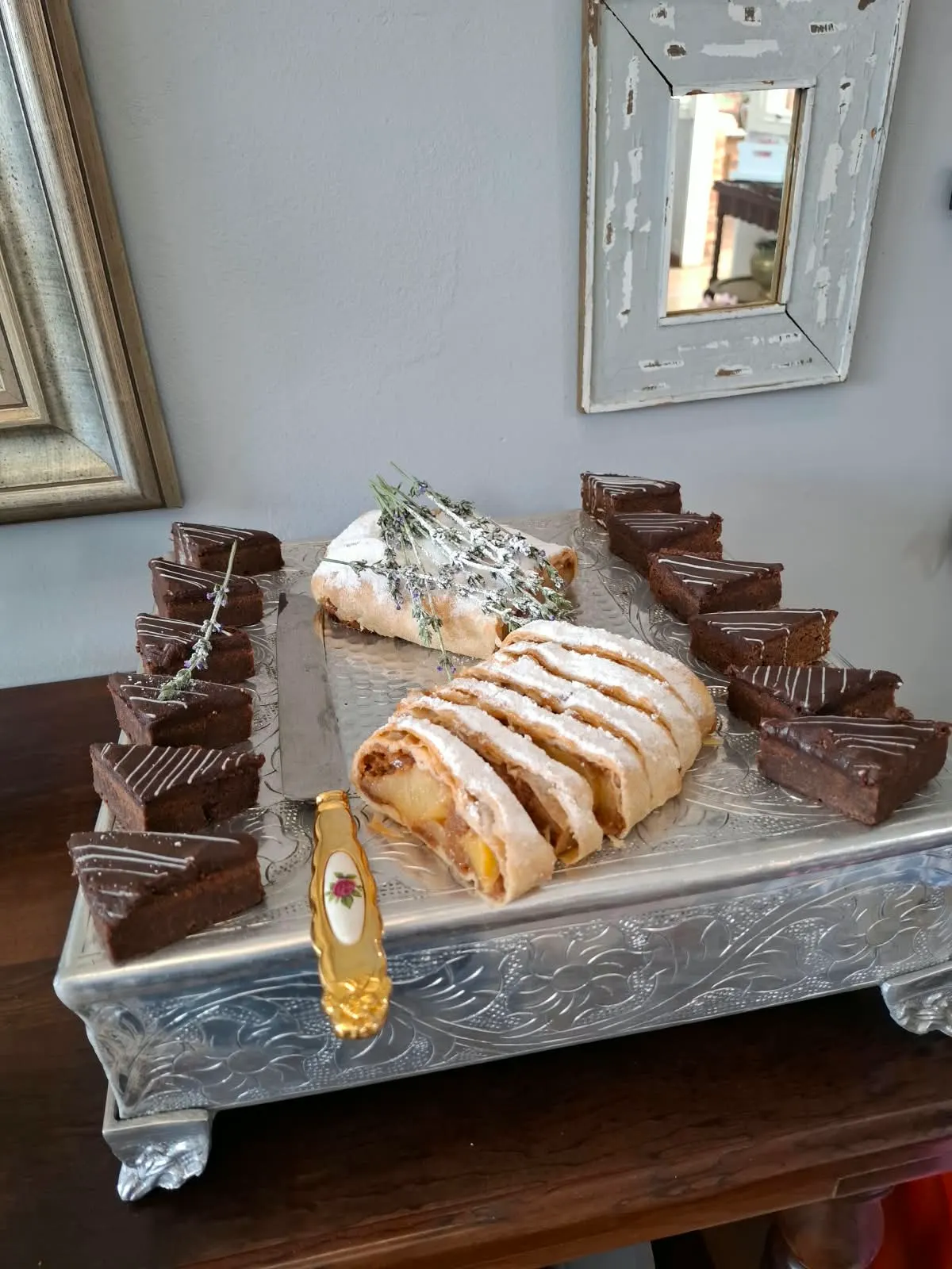 Apple strudel with lavender and chocolate cake wedges on an embossed silver tray